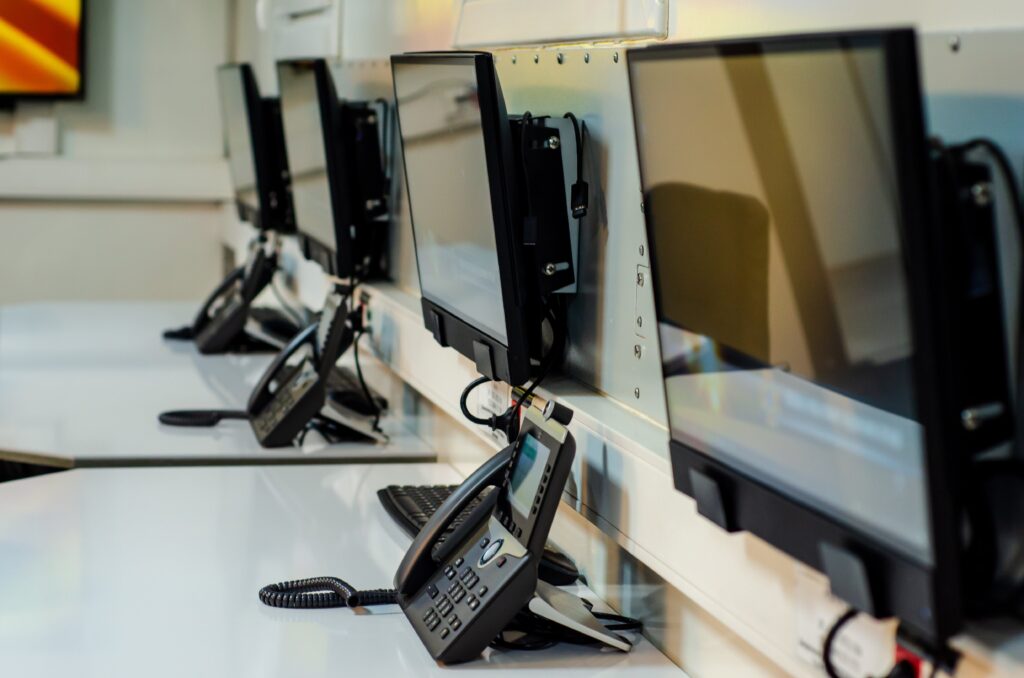 row of computers set up for a combination online and lecture training program