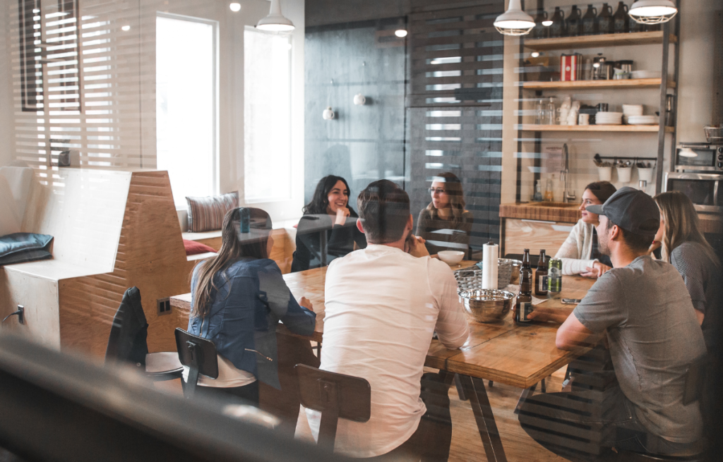 group of coworkers in a collaborative office meeting learning together